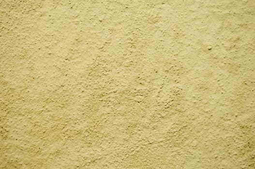 Detail of a rugged yellow wall
