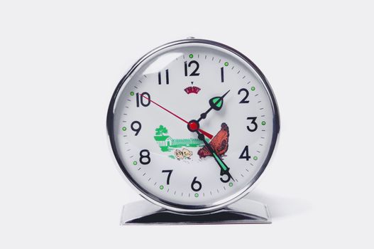 Isolated image of a vintage alarm clock with farm illustration