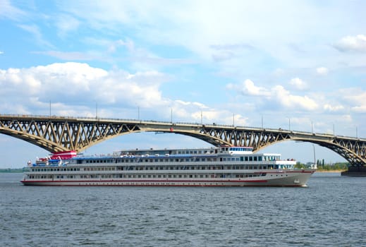 A ship passes under the bridge through the Volga River in Saratov.