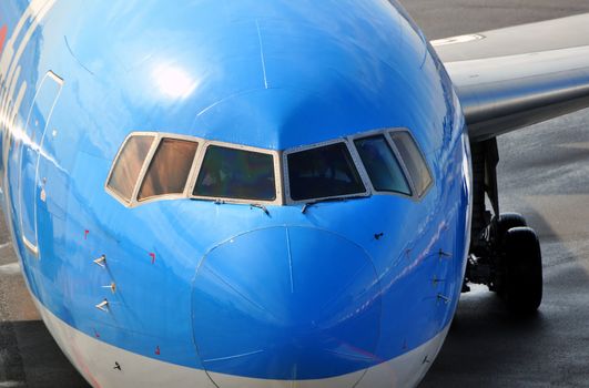 Air transportation: Close-up of a passenger airliner approaching the gate.