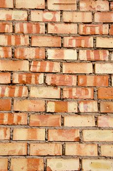 Fragment of old squared red brick wall.