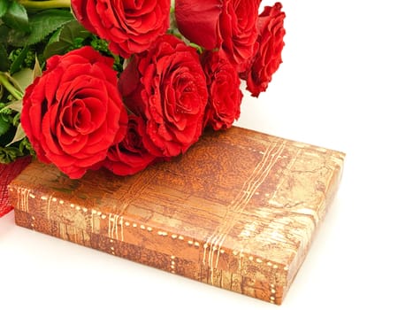 Red roses on a box with a gift 