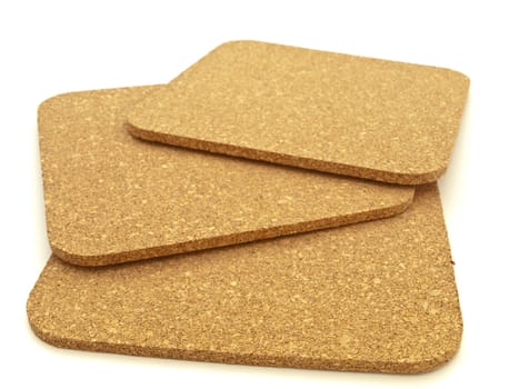  brown cork tablet over the white background
