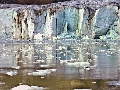 Artic Glacier in Svalbard melting into water