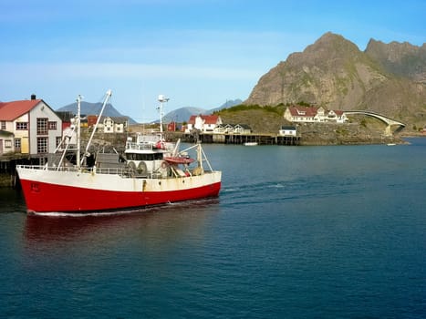 Norwegian boat on blue sea in lofoten island, Norway