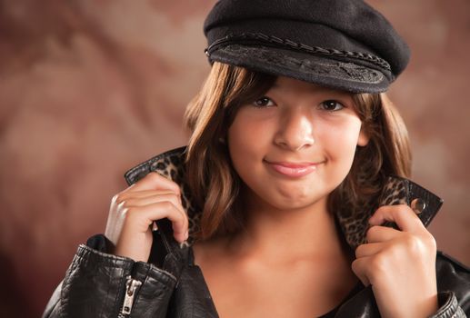 Pretty Hispanic Girl with Hat and Leather Jacket Studio Portrait.