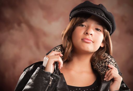 Pretty Hispanic Girl with Hat and Leather Jacket Studio Portrait.