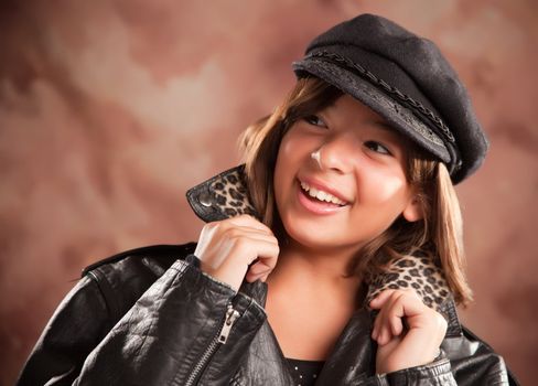 Pretty Hispanic Girl with Hat and Leather Jacket Studio Portrait.