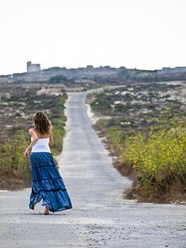 Lonely woman in middle of nowhere running away in fear