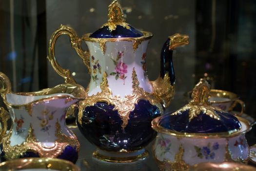 Antique porcelain coffee set in a show window
