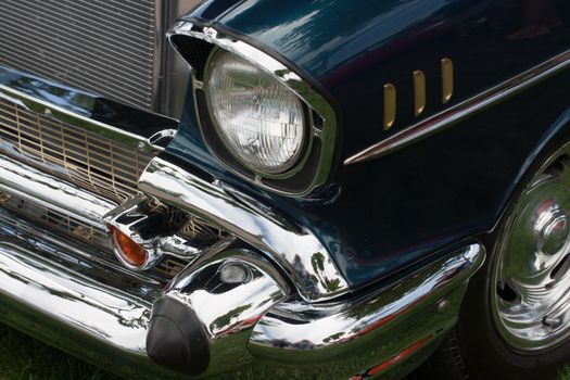 front of a classic car with headlight and fender