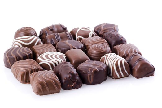 Bunch of belgian chocolates on a white background.