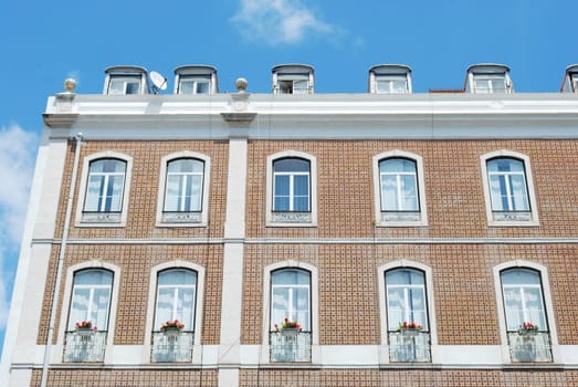 traditional and classic residential building (flowers in balcony)