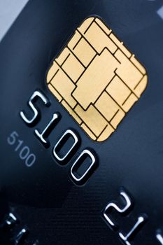 Closeup of a credit card with a gold chip