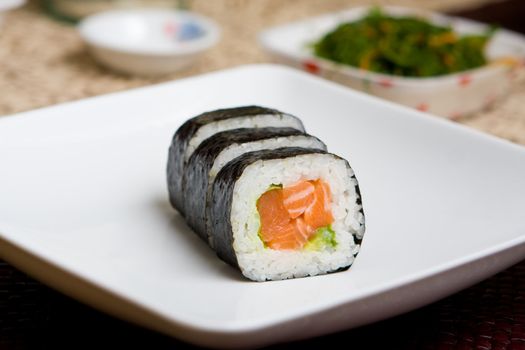 Fresh japanese salmon sushi served on a white plate