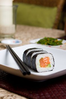 Fresh japanese salmon sushi served on a white plate