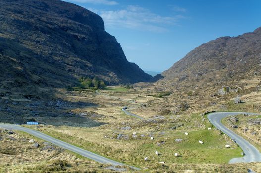 Road going down the valley heading to Gap of Dunloe, Ireland