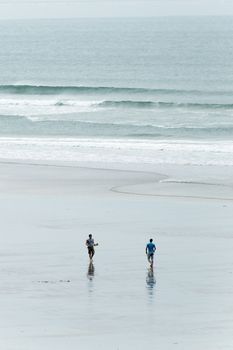Logboard surfers at Dinbgle, West Ireland