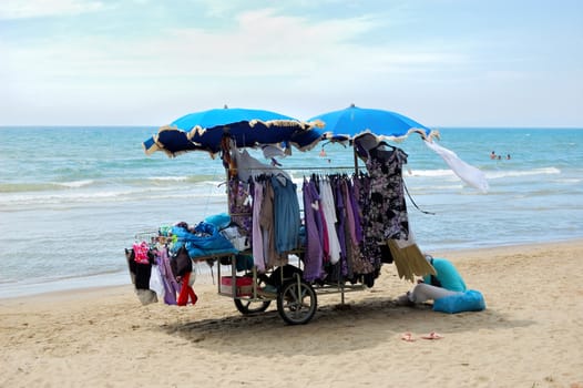 isolated beach vendor in a summer sunny day