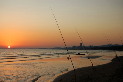 Sea fishing at sunset (Follonica, Italy)