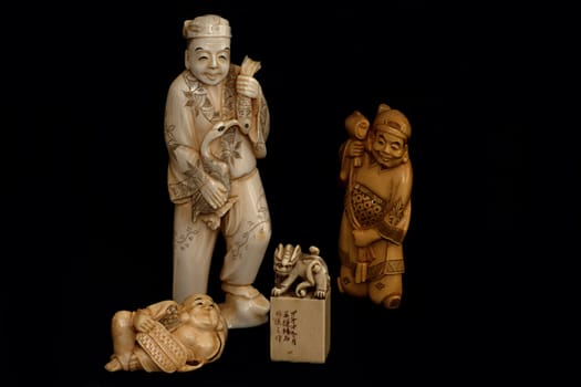 A group of japanese chinese ivory carvings okimono