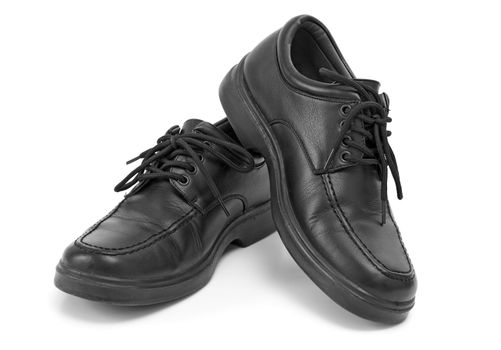 A pair of mens black dress shoes.