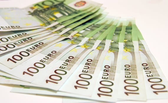 100 Euro notes on a white background.
