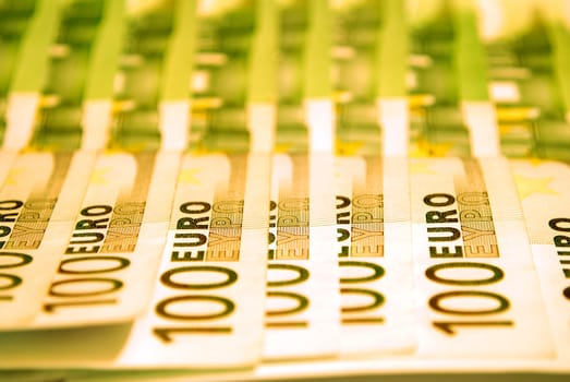 100 Euro notes on a white background.
