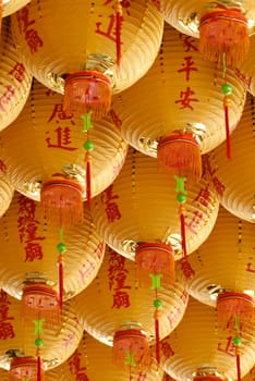 Here are a lot of yellow chinese classic lanterns.