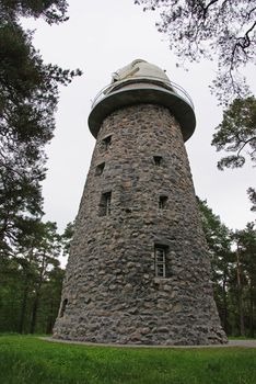 On a high old tower the telescope is established