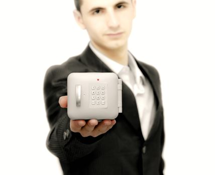 Young business man with a safe in right hand