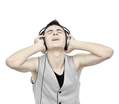 Teenager listening music on headphones isolated on white background:NOTE:Grain was added.Strong contrast photography