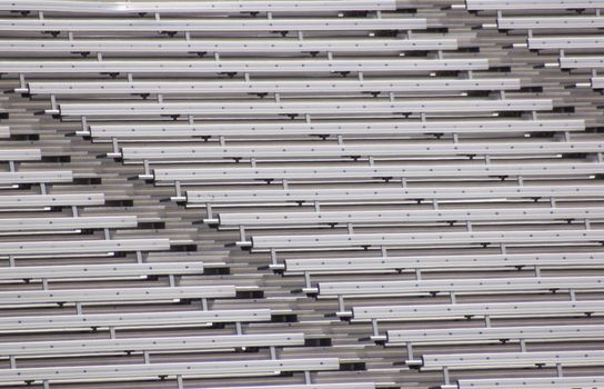 Empty bleachers on a warm summer day.