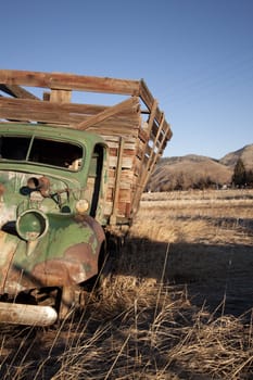 old rusty farm equipment in the middle of a field