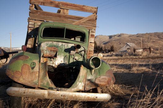 old rusty farm equipment in the middle of a field