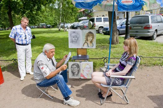 Sidewalk artist in Sankt Petersburg, Russia, taken on June 2011