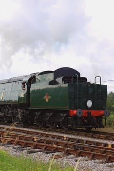 A steam engine arriving at Harmans Cross station in Dorset, part of the Swanage steam railway Network.