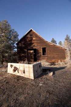 an old cabin barn that has been abandoned.