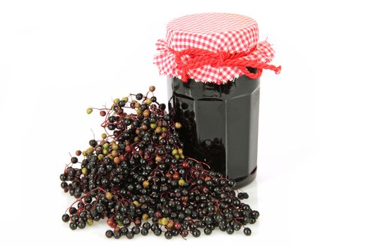 Elderberry marmelade on bright background. Shot in studio.