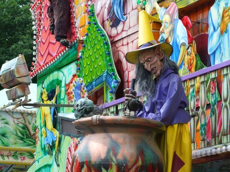 Colourful witch figure in a amusement park 