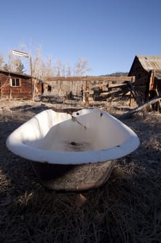 old bathtub in a field abandoned country vintage