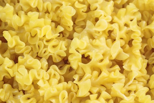 Yellow noodles close up as background