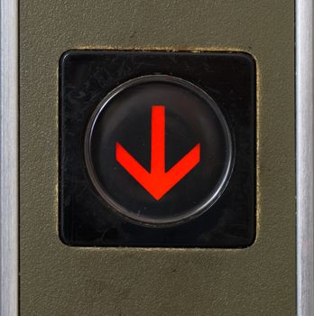 It is close-up elevator button of down sign.