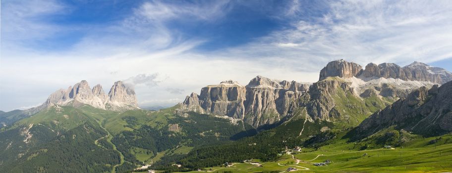 summer view of italian Dolomites in val di fassa near pordoi pass with Sassolungo - Langkofel mount and Sella group. Photo taken with polarizer filter