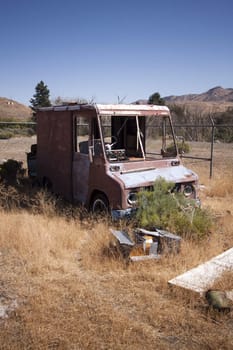 An old rusty abandoned car.