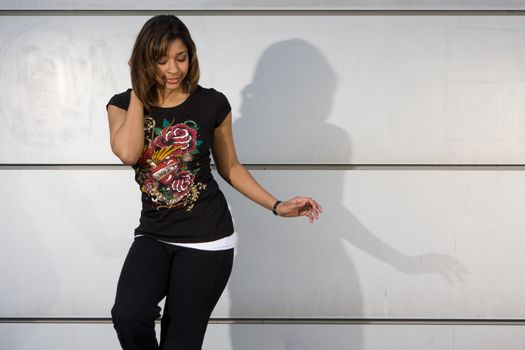 Young teenager grooving to hip hop music on the dance floor