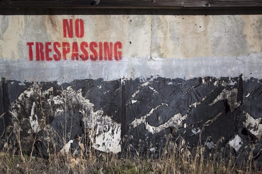 spray painted no trespassing