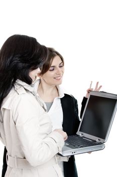 Two female young students watching something on a laptop