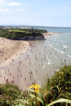 ballybunion beach crowded with people on a hot day