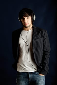 Young Man listening to music with headphones